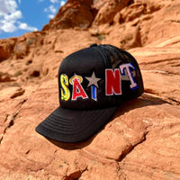 SAINT WRAP TRUCKER HAT BLACK