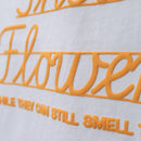 GIVE THEM THEIR FLOWERS SPELL OUT TEE WHITE