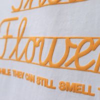 GIVE THEM THEIR FLOWERS SPELL OUT TEE WHITE
